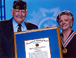Image of Cristy receiving the Veterans of Foreign Wars Hall of Fame.